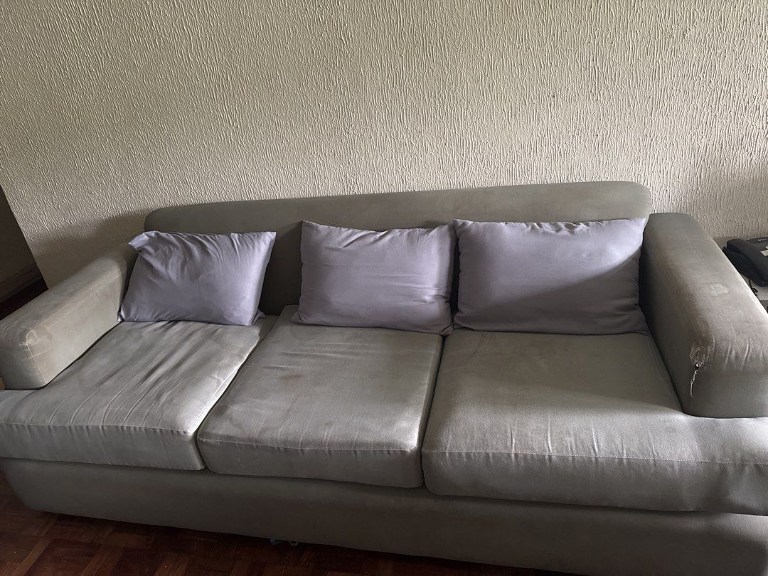 Grey Fabric Sofa Set 5 Seater (Category: Sofas) located in Makati City. Submitted by decluttermakati (Listing ID 1443729825, Image 2). Description: - Grey fabric sofa set - Includes 5-seater sofa and matching armchair - Some signs of wear on fabric (more noticeable on armchair) - Still comfortable and functional - Perfect for living room or lounge - Pickup only.