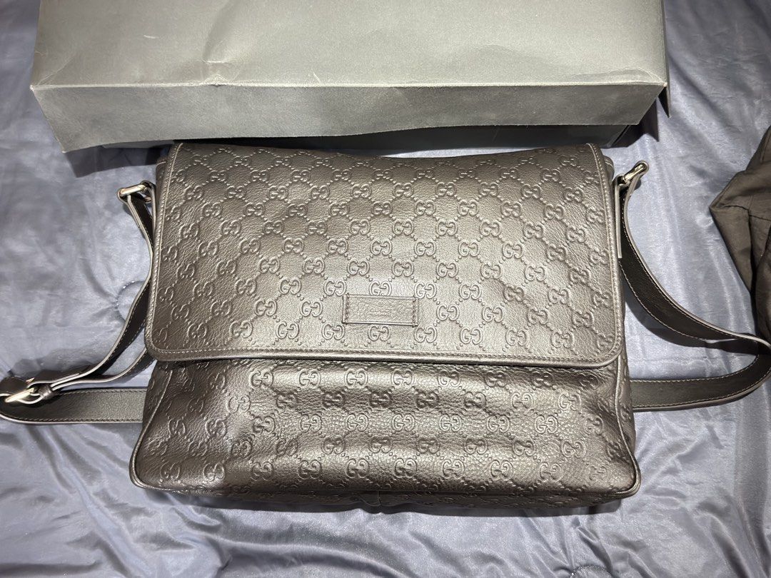 Gucci Guccissima Leather Messenger Bag Black (Category: Luxury Bags & Wallets) located in Manila. Submitted by donpd (Listing ID 1443812016, Image 1). Description: - Brand New. Never used. Authentic Gucci messenger bag - black Guccissima leather with embossed GG pattern - Spacious interior with Gucci lining - Adjustable shoulder strap - Includes dust bag and box - Brand new never used - Given as a gift around 2015-2020. Never used and placed only