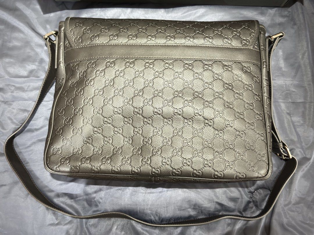 Gucci Guccissima Leather Messenger Bag Black (Category: Luxury Bags & Wallets) located in Manila. Submitted by donpd (Listing ID 1443812016, Image 2). Description: - Brand New. Never used. Authentic Gucci messenger bag - black Guccissima leather with embossed GG pattern - Spacious interior with Gucci lining - Adjustable shoulder strap - Includes dust bag and box - Brand new never used - Given as a gift around 2015-2020. Never used and placed only