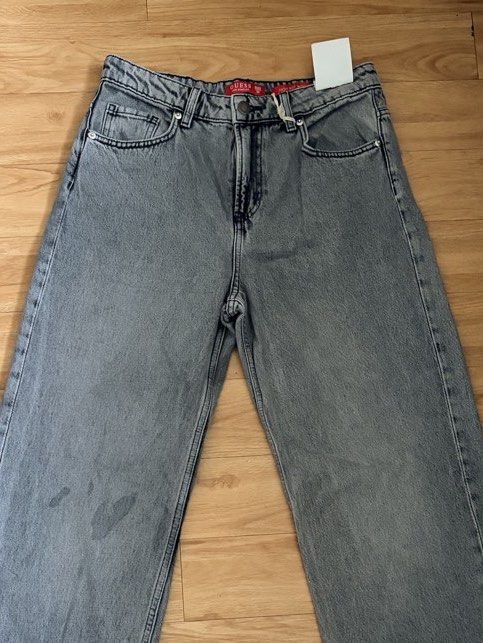 Guess Grey Wide Leg Jeans Size 30 (Category: Jeans) located in Pasig City. Submitted by nikkiniksniks (Listing ID 1443769337, Image 2). Description: - Brand: Guess - Style: Wide leg jeans - Rise: High waisted - Color: Grey - Perfect for creating a casual look. -Overrunsss, meron syang mga markings(splash nung dye) -But still verry good condition Hard denim non stretch.