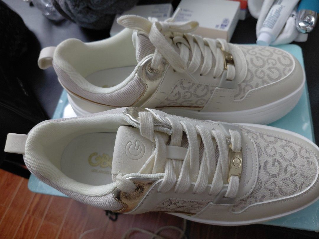 GUESS Platform Sneakers Cream Gold Logo (Category: Sneakers) located in Quezon City. Submitted by jrodf (Listing ID 1443735034, Image 2). Description: - Cream colored GUESS platform sneakers - All-over GG logo pattern - Gold accents on sides and lace loops - Chunky white platform sole - Lace-up closure - Super cute and stylish! -size 9.5.