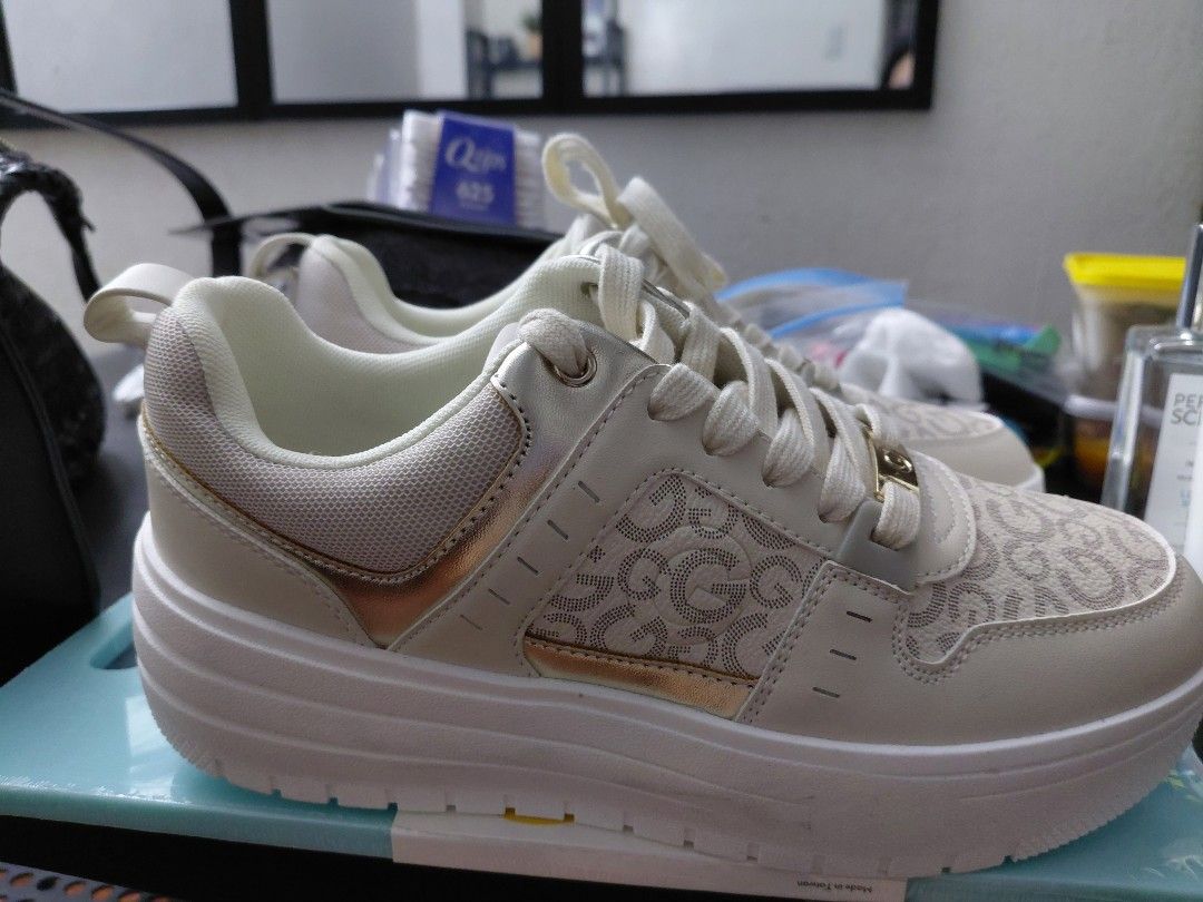 GUESS Platform Sneakers Cream Gold Logo (Category: Sneakers) located in Quezon City. Submitted by jrodf (Listing ID 1443735034, Image 1). Description: - Cream colored GUESS platform sneakers - All-over GG logo pattern - Gold accents on sides and lace loops - Chunky white platform sole - Lace-up closure - Super cute and stylish! -size 9.5.