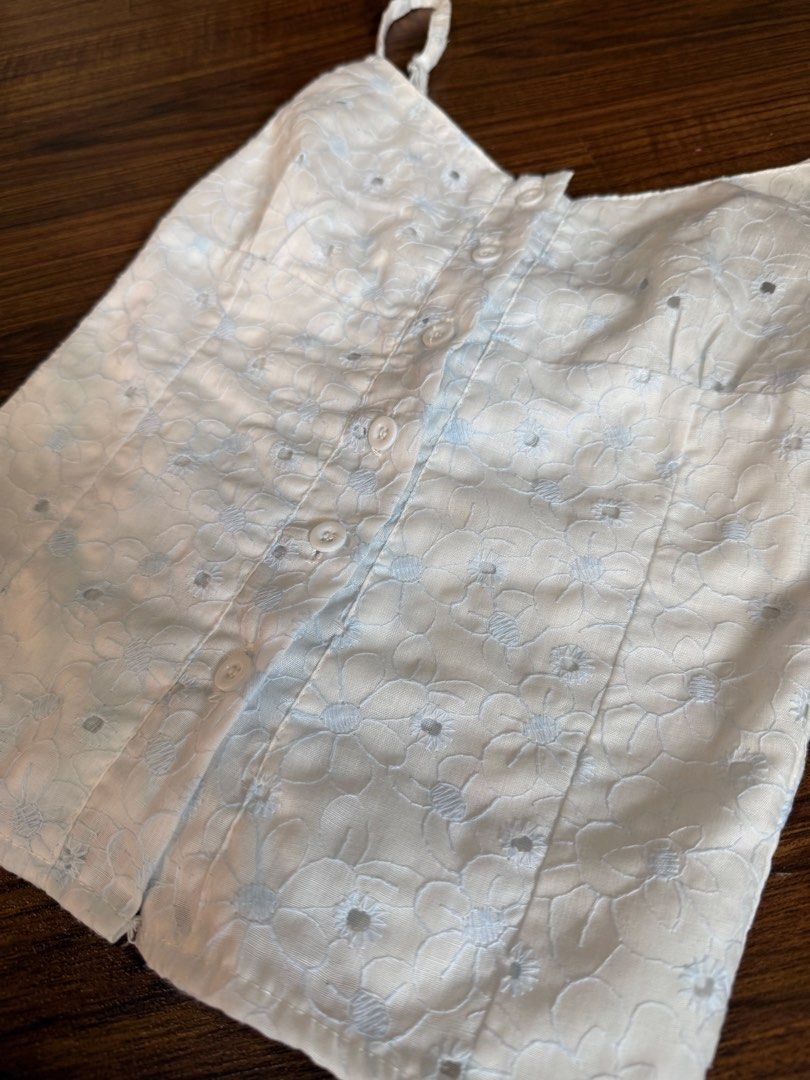 Herpalais Cami Top XS to S (Category: Sleeveless) located in Quezon City. Submitted by closetcute (Listing ID 1443813261, Image 2). Description: XS-S Light blue floral eyelet details Button-front design Smocked back Adjustable straps.