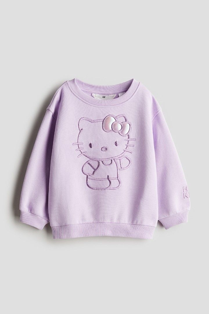 H&M Kids Hello Kitty Lavender Sweatshirt (Category: Babies & Kids Fashion) located in Cavite. Submitted by frombellas (Listing ID 1443734397, Image 1). Description: - Cute lavender sweatshirt for kids - Features Hello Kitty graphic on the front - Small embroidered detail on the sleeve - Brand: H&M - Ideal for casual wear.