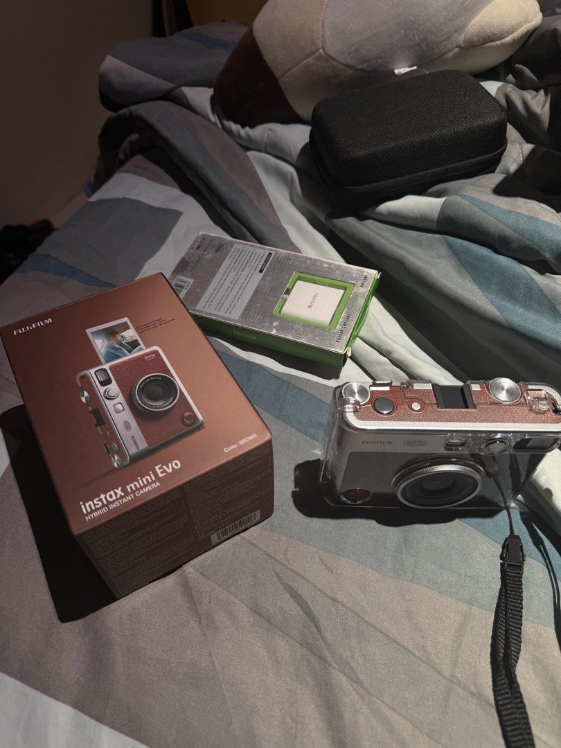 Instax mini evo (brown) (Category: Cameras) located in Quezon City. Submitted by soreal478 (Listing ID 1443751141, Image 2). Description: - Fujifilm Instax Mini Evo (Brown) - Hybrid instant camera (digital photos + instant prints) - Includes original box - Comes with a protective case - New 10PC sheet extra .