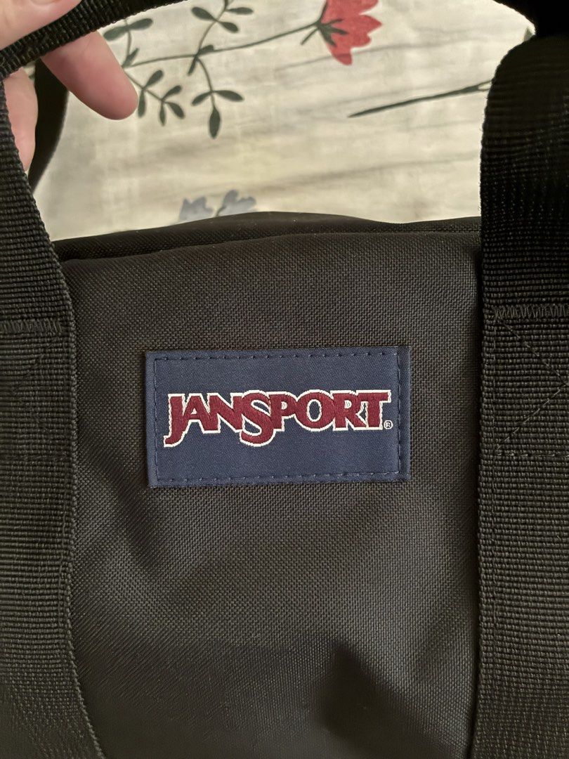 Jansport Black Duffle Bag with Shoulder Strap (Category: Backpacks) located in San Jose del Monte. Submitted by yllib1112 (Listing ID 1443708970, Image 3). Description: - Black Jansport duffle bag - Features top handles and a detachable shoulder strap - Unique 'JS' logo zippers - Lined interior - Ideal for everyday use or travel 1 week lng nagamit, bagong bago no issue. 1990 orig price.