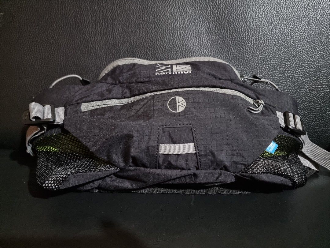 Karrimor Raid 5 Black Belt Bag (Category: Belt bags, Clutches and Pouches) located in Imus. Submitted by aim_for_less (Listing ID 1443871747, Image 2). Description: Karrimor Raid 5 Waist Bag - DIMES: 16.5"W X 8.5"H X 7.5"L - Capacity: 5 Litre. Moulded back system. Ultra breathable mesh. - Color: Black with grey accents - Features: Mesh side pockets, bright lime green interior - Two mesh bottle side pockets. Includes 2 x 600ml bottles. Side compre