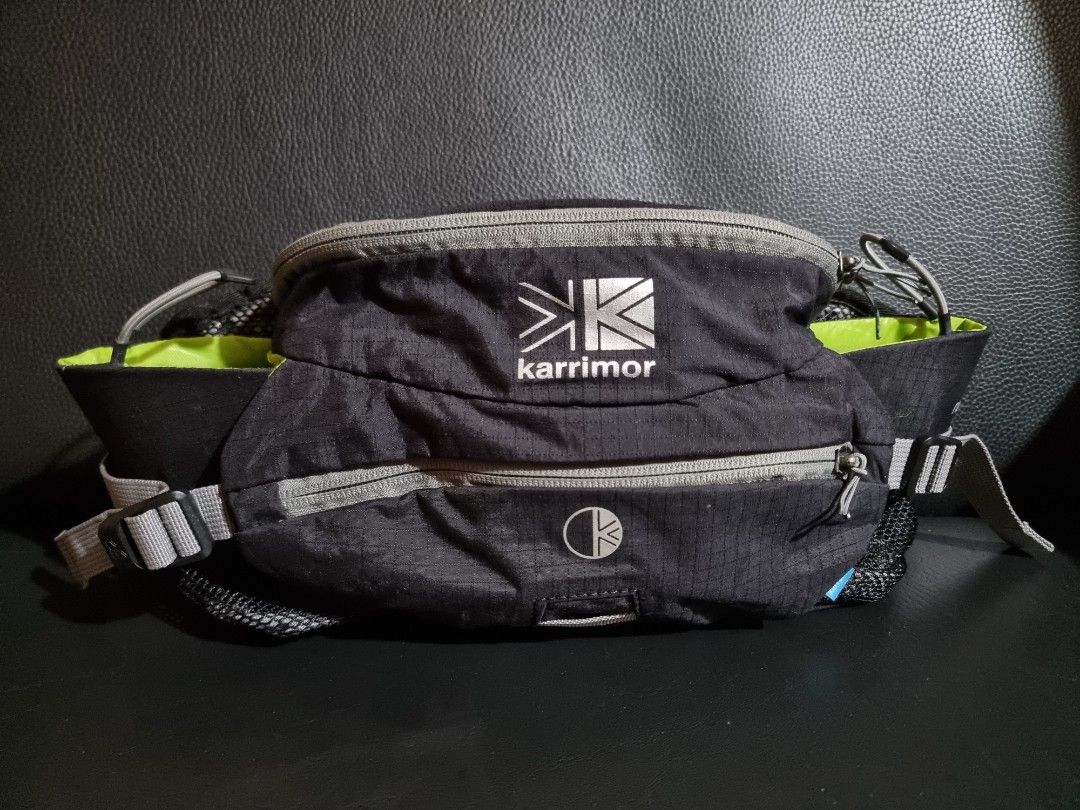 Karrimor Raid 5 Black Belt Bag (Category: Belt bags, Clutches and Pouches) located in Imus. Submitted by aim_for_less (Listing ID 1443871747, Image 1). Description: Karrimor Raid 5 Waist Bag - DIMES: 16.5"W X 8.5"H X 7.5"L - Capacity: 5 Litre. Moulded back system. Ultra breathable mesh. - Color: Black with grey accents - Features: Mesh side pockets, bright lime green interior - Two mesh bottle side pockets. Includes 2 x 600ml bottles. Side compre