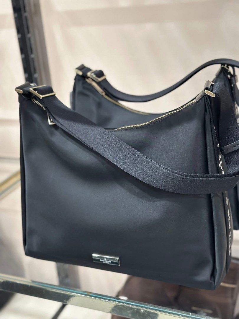 Kate Spade Black Nylon Shoulder Bag (Category: Luxury Bags & Wallets) located in San Antonio. Submitted by arianeofficial (Listing ID 1443771446, Image 1). Description: ₱7,500 po ito sa mga reseller. Kaya get nyo na for only ₱5,499 only❗️❗️❗️ FROM U.S - Brand: Kate Spade - Material: Black Nylon - Style: Shoulder Bag - Strap: Adjustable with logo detail - Closure: Zip - Hardware: Silver tone - Features: Spacious interior, clean and simple design -