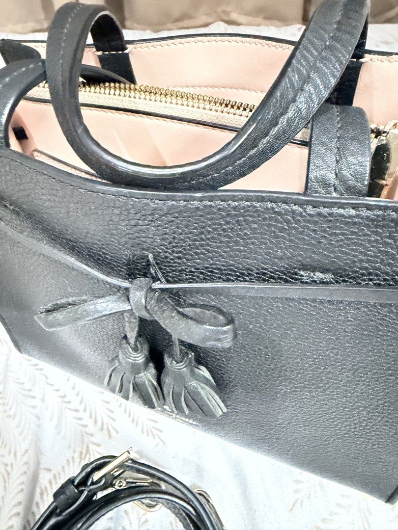 Kate Spade Small Satchel Black Leather KC417 (Category: Luxury Bags & Wallets) located in Manila. Submitted by almacringdp (Listing ID 1443761421, Image 3). Description: - Authentic Kate Spade small satchel - Kate Spade Hayes Street Sam - Material: Black pebbled leather - Elegant tassel details - Versatile: Comes with a detachable crossbody strap for hands-free wear - Interior: Lined with a lovely light pink leather - Value: Original tag shows co