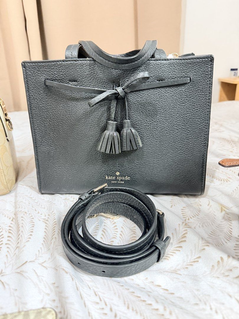 Kate Spade Small Satchel Black Leather KC417 (Category: Luxury Bags & Wallets) located in Manila. Submitted by almacringdp (Listing ID 1443761421, Image 1). Description: - Authentic Kate Spade small satchel - Kate Spade Hayes Street Sam - Material: Black pebbled leather - Elegant tassel details - Versatile: Comes with a detachable crossbody strap for hands-free wear - Interior: Lined with a lovely light pink leather - Value: Original tag shows co