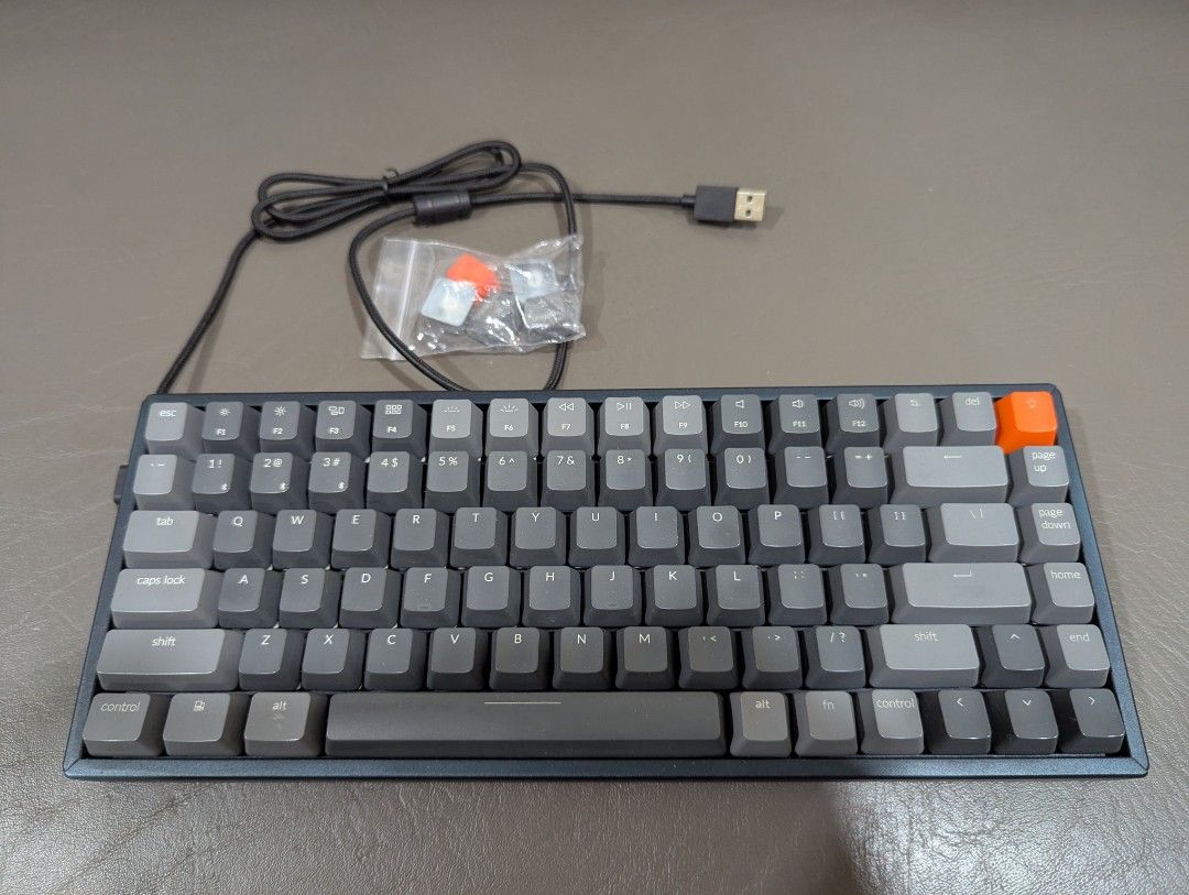 Keychron K2 Mechanical Keyboard (Category: Computer Keyboard) located in Makati City. Submitted by bon.bon.bon (Listing ID 1443763299, Image 2). Description: - Keychron K2 mechanical keyboard - RGB, Aluminum, Gateron Brown keys, Non-HotSwap - Wireless via Bluetooth, MacOS compatible - Compact 75% layout - Includes USB-C cable and extra keycaps.