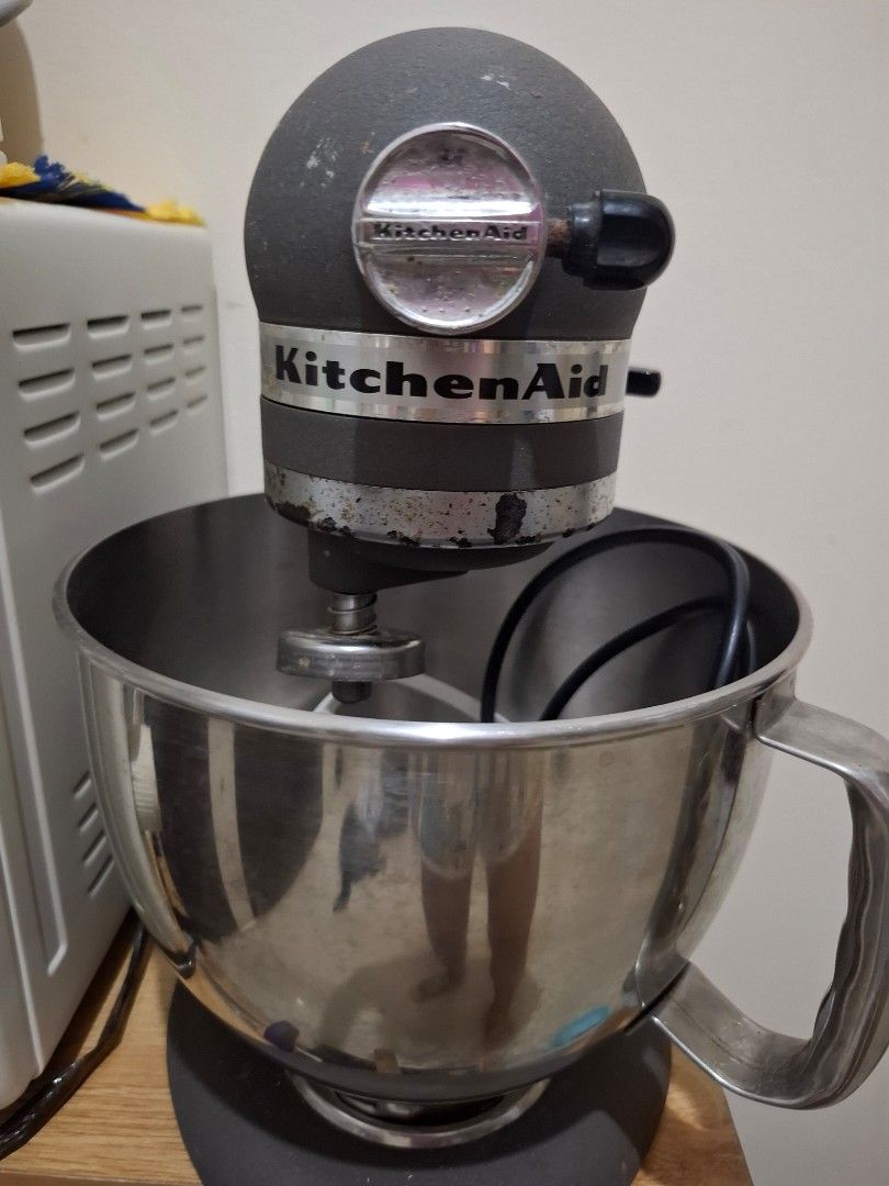 KITCHEN AID ARTISAN SERIES STAND MIXER (Category: Juicers, Blenders & Grinders) located in Quezon City. Submitted by amai.closet (Listing ID 1443837305, Image 3). Description: KitchenAid Artisan Series Stand Mixer features a dark gray finish and a durable stainless steel mixing bowl.It is designed with a 10-speed motor, providing versatility for various mixing, kneading, and whipping tasks. The model includes essential attachments such as a flat 