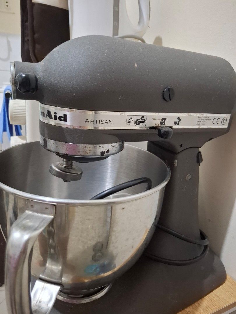 KITCHEN AID ARTISAN SERIES STAND MIXER (Category: Juicers, Blenders & Grinders) located in Quezon City. Submitted by amai.closet (Listing ID 1443837305, Image 1). Description: KitchenAid Artisan Series Stand Mixer features a dark gray finish and a durable stainless steel mixing bowl.It is designed with a 10-speed motor, providing versatility for various mixing, kneading, and whipping tasks. The model includes essential attachments such as a flat 
