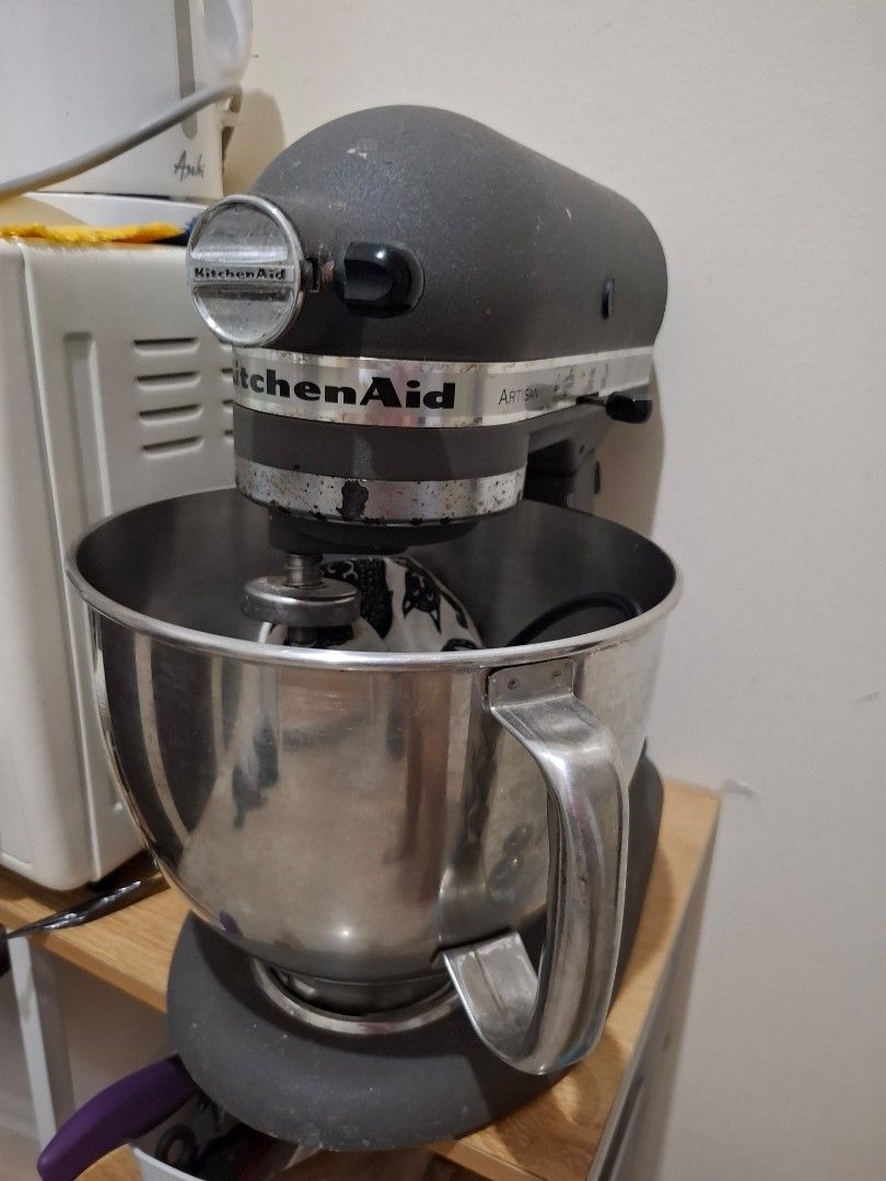 KITCHEN AID ARTISAN SERIES STAND MIXER (Category: Juicers, Blenders & Grinders) located in Quezon City. Submitted by amai.closet (Listing ID 1443837305, Image 2). Description: KitchenAid Artisan Series Stand Mixer features a dark gray finish and a durable stainless steel mixing bowl.It is designed with a 10-speed motor, providing versatility for various mixing, kneading, and whipping tasks. The model includes essential attachments such as a flat 