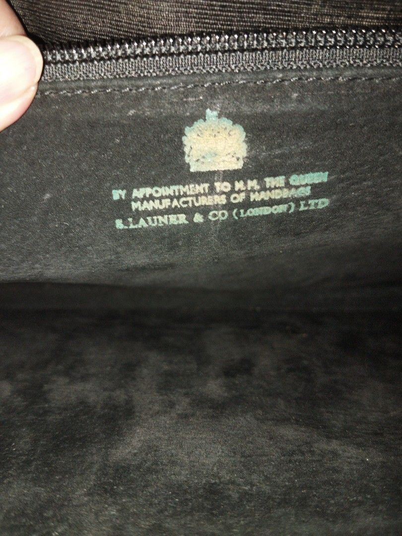 Launer bag (Category: Luxury Bags & Wallets) located in Makati City. Submitted by fiercewind.7bf54e (Listing ID 1443774368, Image 3). Description: - Authentic Launer bag - Classic black color - Sophisticated lizard-embossed texture - Elegant gold hardware - Versatile design for any occasion.