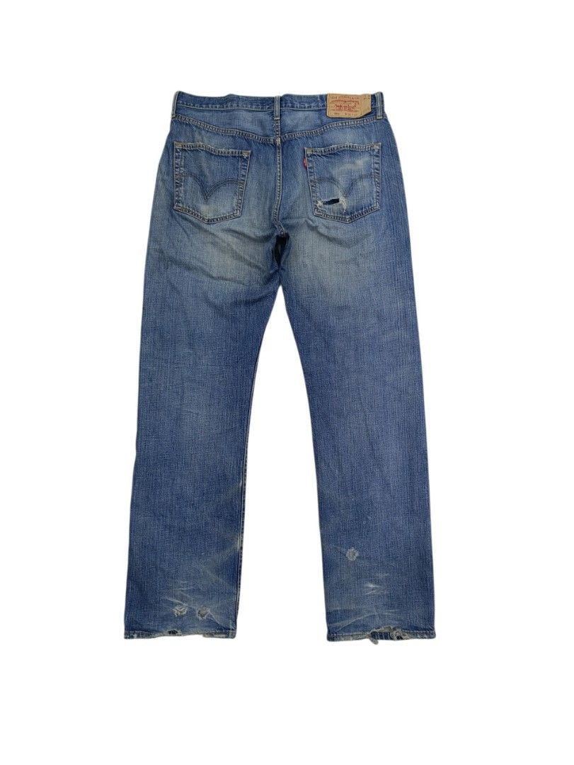 Levi's 501 Jeans Distressed Blue Denim Button Fly (Category: Jeans) located in Manila. Submitted by danielcerdo21 (Listing ID 1443860695, Image 2). Description: - Classic Levi's 501 jeans - Medium blue wash - Distressed details with patch on right leg - Button fly closure - Minor wear: small rip on back pocket, slightly frayed hem - Ideal for everyday wear - Size 36 - Length 47 - Hem 9 - Long pants.