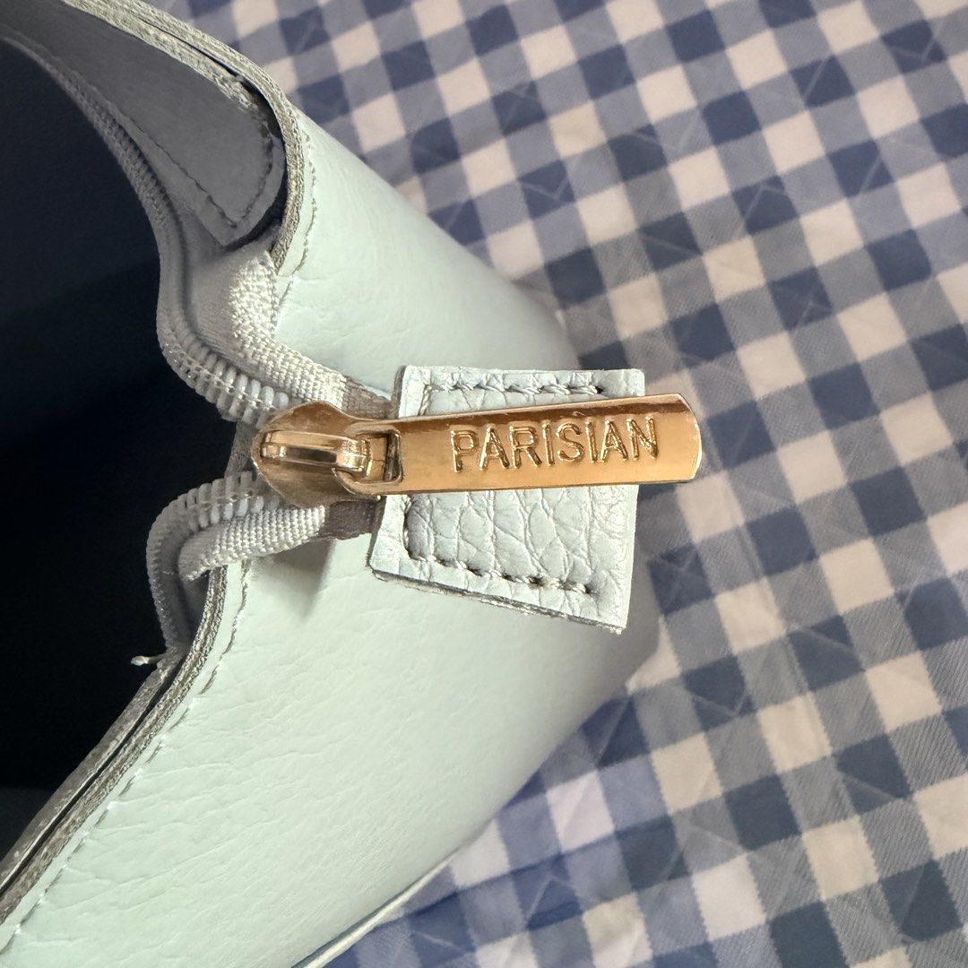 Light Blue Parisian Tote Bag with Front Pocket (Category: Tote Bags) located in Manila. Submitted by swiftgem_e3844a (Listing ID 1443763804, Image 2). Description: - Light blue tote bag - Front pocket with snap closure - Zip-top main compartment - Interior zippered pocket - Internal divider - 'PARISIAN' engraved zipper pull - Ideal size for everyday use.