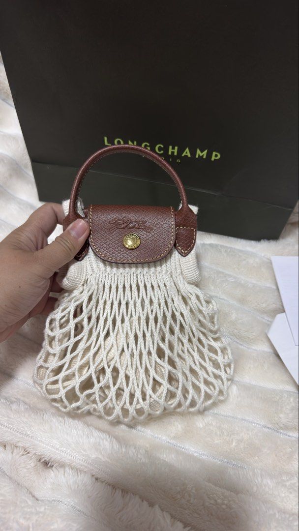 Longchamp Paris Net Bag with Leather Handles (Category: Luxury Bags & Wallets) located in Makati City. Submitted by iceejoy (Listing ID 1443803415, Image 3). Description: Used onced in Boracay Nakatambak nalang Almost new With paper bag and receipt Payment first Buyer will shoulder delivery or shipping fee Dm for LP.