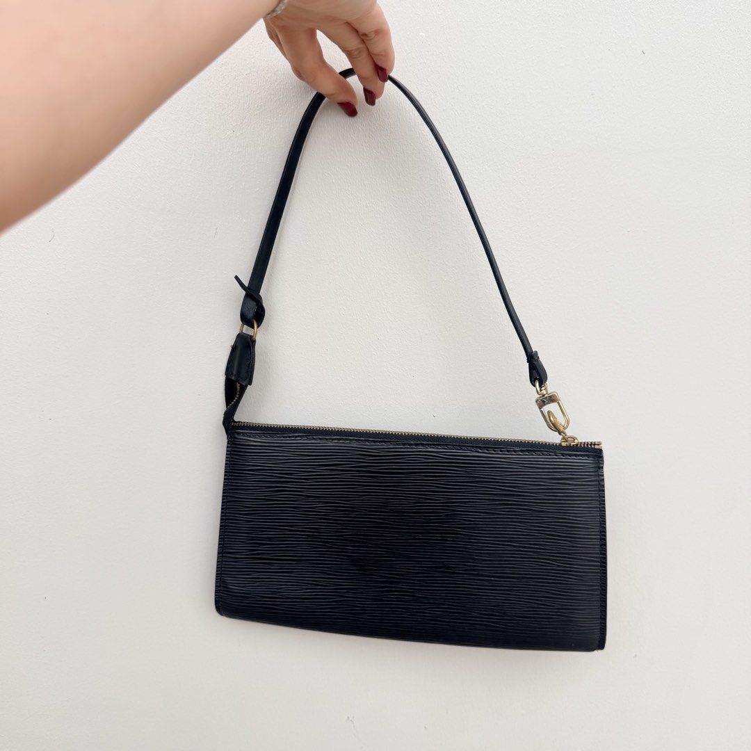 Louis Vuitton Epi Leather Black ghw (Category: Luxury Bags & Wallets) located in Mandaluyong City. Submitted by preloveditemph (Listing ID 1443807717, Image 3). Description: - Classic black Louis Vuitton clutch - Genuine Epi leather texture - Gold hardware zipper - Slim profile, perfect for essentials - Can be used as a pouch or a small shoulder bag (strap not included) - Versatile for day or night use RANK A GUARANTEED ORIGINAL.