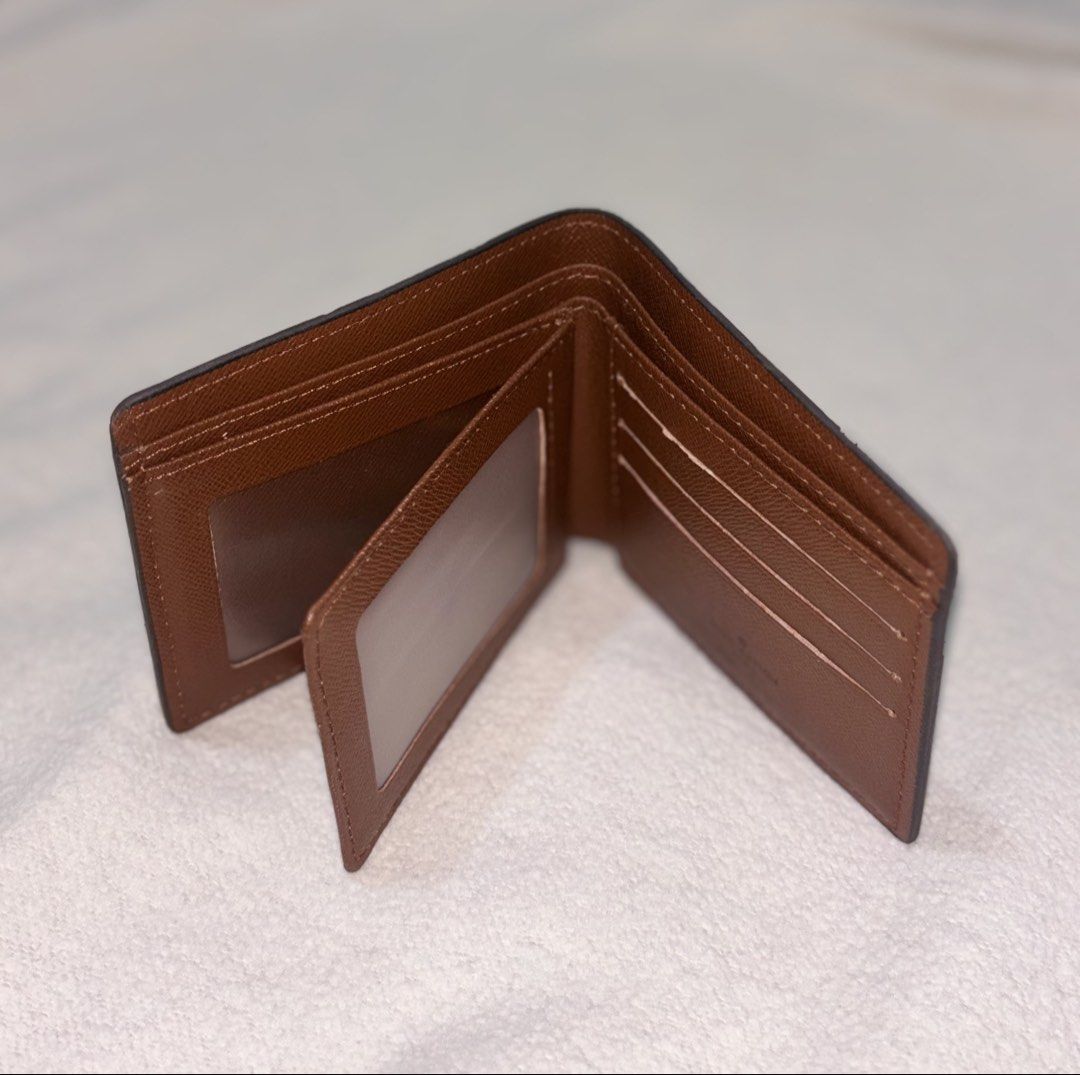 Louis Vuitton Monogram Bifold Wallet (Category: Luxury Bags & Wallets) located in Bago City. Submitted by christiaaan0515 (Listing ID 1443864157, Image 2). Description: - Classic Louis Vuitton monogram bifold wallet - Excellent condition - No flaws.
