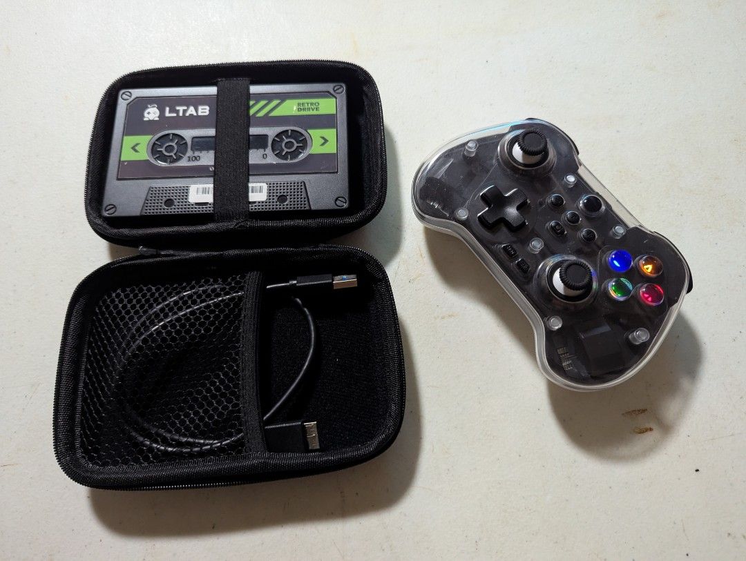 LTAB Gaming Hub Retro Console with Controller and Case (Category: Controllers) located in Quezon City. Submitted by cojikmendez (Listing ID 1443711468, Image 3). Description: FOR SALE DI NA NAGAGAMIT! LTAB RETRO DRIVE USED LANG PO FOR A WEEK THEN DI NA NAGAMIT. ISSUE: DI MACONNECT SA WIRELESS YUNG CONTROLLER, WALA PONG CORD YUNG CONTROLLER TYPE C NAMAN SIYA PWEDE GAMITIN MGA PANG CHARGER. 📍PLEASANT / SAVANO / SM SJDM 💵Gcash / Maya / Bank Transf