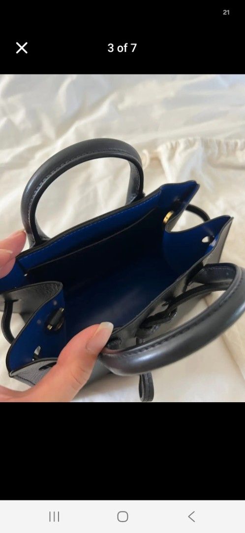 Mansur Gavriel Mini Bucket Bag Black Leather Blue Interior (Category: Luxury Bags & Wallets) located in San Juan City. Submitted by simplyj18 (Listing ID 1443769760, Image 2). Description: - Authentic Mansur Gavriel Mini Bucket Bag - Color: Black leather exterior, vibrant blue interior - Features: Top handles, detachable crossbody strap - Includes: Original dust bag and tags - Condition: wear or peeling on interior edges (as pictured).