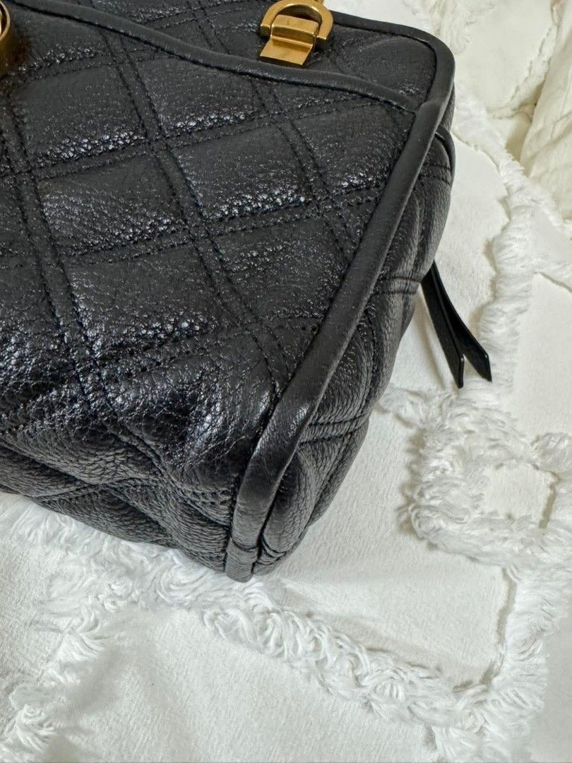 Marc Jacobs Black Quilted Leather Camera Bag Gold Chain (Category: Luxury Bags & Wallets) located in Bulacan. Submitted by vintage_purge (Listing ID 1443758278, Image 3). Description: - Authentic Marc Jacobs black quilted leather camera bag - Features iconic gold MJ logo hardware - Chunky gold chain strap for a stylish look - Convenient front pocket for quick access - Secure zip closure to keep your belongings safe - Versatile for everyday use or
