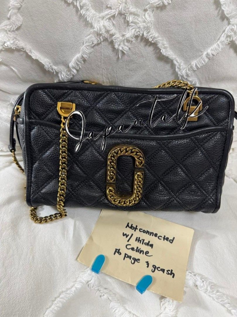 Marc Jacobs Black Quilted Leather Camera Bag Gold Chain (Category: Luxury Bags & Wallets) located in Bulacan. Submitted by vintage_purge (Listing ID 1443758278, Image 1). Description: - Authentic Marc Jacobs black quilted leather camera bag - Features iconic gold MJ logo hardware - Chunky gold chain strap for a stylish look - Convenient front pocket for quick access - Secure zip closure to keep your belongings safe - Versatile for everyday use or