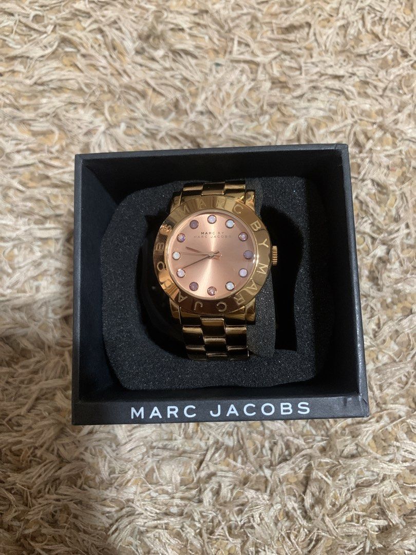 Marc Jacobs Rose Gold Watch (Category: Women's Watches) located in Manila. Submitted by fraghead666 (Listing ID 1443720386, Image 2). Description: - Authentic Marc Jacobs watch - Elegant rose gold finish - Comes with original box - Watch face with charming pink markers - Stylish bracelet-style strap - Versatile accessory for any outfit Never used just worn to try. no scratches and all can send more detailed pics..