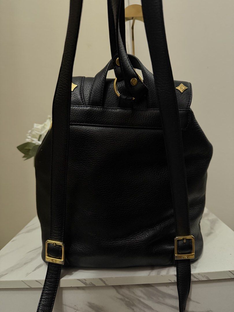 Authentic MCM Germany Backpack Black Leather Large Authentic Vintage (Category: Luxury Bags & Wallets) located in Dasmarinas. Submitted by goaldeluxe (Listing ID 1443904240, Image 3). Description: overall : great condition. — Measurement — Height 13.5”(34.29 cm) Depth 5.75”(14.61 cm) Length (bottom) 10.37”(26.34 cm) .