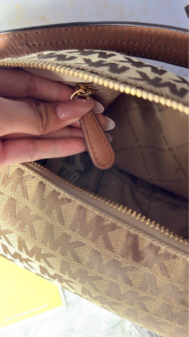 Michael Kors Bedford Hobo (Category: Luxury Bags & Wallets) located in Taguig. Submitted by rodriguezjamieanne (Listing ID 1443757105, Image 3). Description: - used once only - Authentic Michael Kors Bedford shoulder bag - Classic brown and beige MK monogram print - Elegant gold hardware details - Interior with zip pocket and multiple compartments - Comes with original tag - Ideal for everyday use.