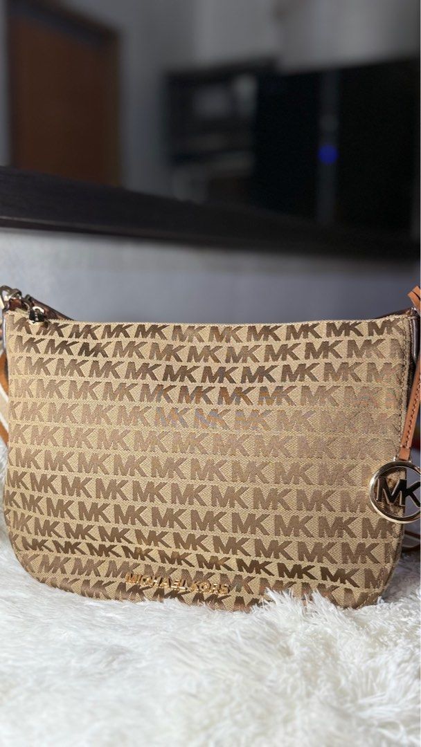 Michael Kors Bedford Hobo (Category: Luxury Bags & Wallets) located in Taguig. Submitted by rodriguezjamieanne (Listing ID 1443757105, Image 1). Description: - used once only - Authentic Michael Kors Bedford shoulder bag - Classic brown and beige MK monogram print - Elegant gold hardware details - Interior with zip pocket and multiple compartments - Comes with original tag - Ideal for everyday use.