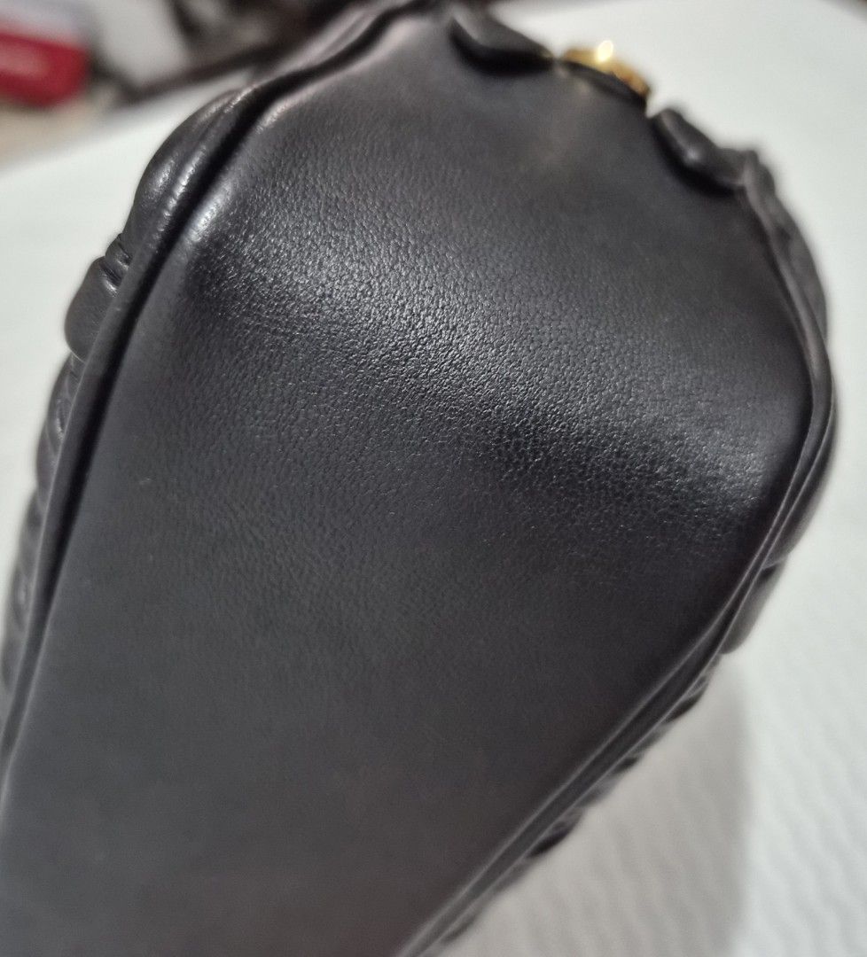 Miu Miu Black Matelassé Leather Pouch (Category: Purses & Pouches) located in Caloocan City. Submitted by rmdesilva (Listing ID 1443711217, Image 3). Description: - Authentic Miu Miu pouch - Black quilted matelassé leather - Gold zipper closure - Ideal for organizing essentials or as a standalone clutch - Approximate dimensions: 8 inches wide x 4 inches tall - Soft and supple leather.