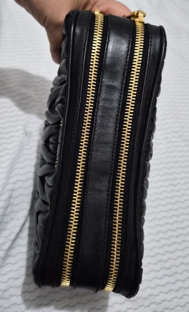 Miu Miu Black Matelassé Leather Pouch (Category: Purses & Pouches) located in Caloocan City. Submitted by rmdesilva (Listing ID 1443711217, Image 2). Description: - Authentic Miu Miu pouch - Black quilted matelassé leather - Gold zipper closure - Ideal for organizing essentials or as a standalone clutch - Approximate dimensions: 8 inches wide x 4 inches tall - Soft and supple leather.