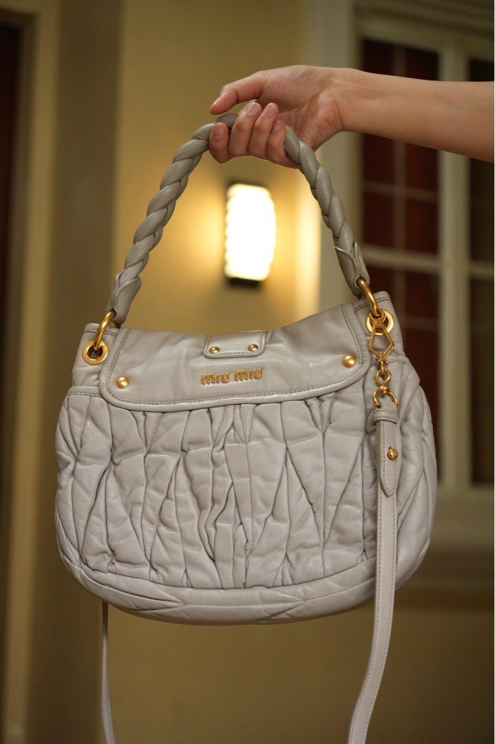 Miu Miu Light Gray Coffer Matelasse Bag (Small) (Category: Luxury Bags & Wallets) located in Quezon City. Submitted by dlm03 (Listing ID 1440710995, Image 3). Description: Authentic Miu Miu Coffer Bag crafted in luxurious leather with the iconic Matelassé detailing and gold-tone hardware. A timeless Y2K-era piece and one of Miu Miu’s most recognizable archive bags. Condition: • Excellent Preloved Condition (Rank A-/AB) • Soft and supple leather •