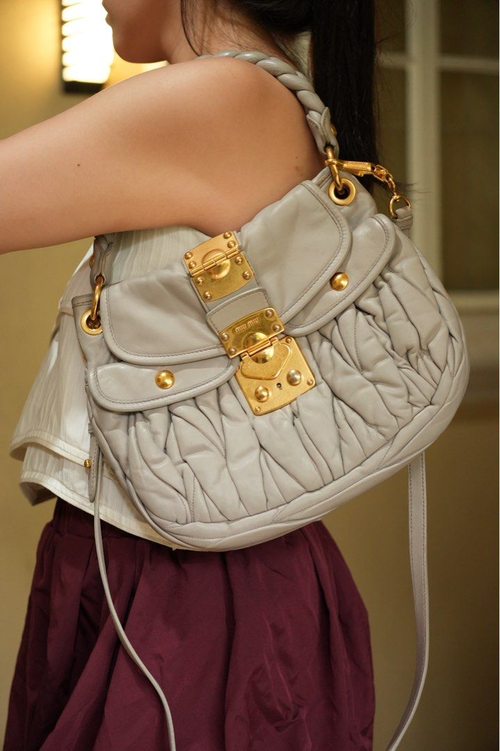 Miu Miu Light Gray Coffer Matelasse Bag (Small) (Category: Luxury Bags & Wallets) located in Quezon City. Submitted by dlm03 (Listing ID 1440710995, Image 1). Description: Authentic Miu Miu Coffer Bag crafted in luxurious leather with the iconic Matelassé detailing and gold-tone hardware. A timeless Y2K-era piece and one of Miu Miu’s most recognizable archive bags. Condition: • Excellent Preloved Condition (Rank A-/AB) • Soft and supple leather •