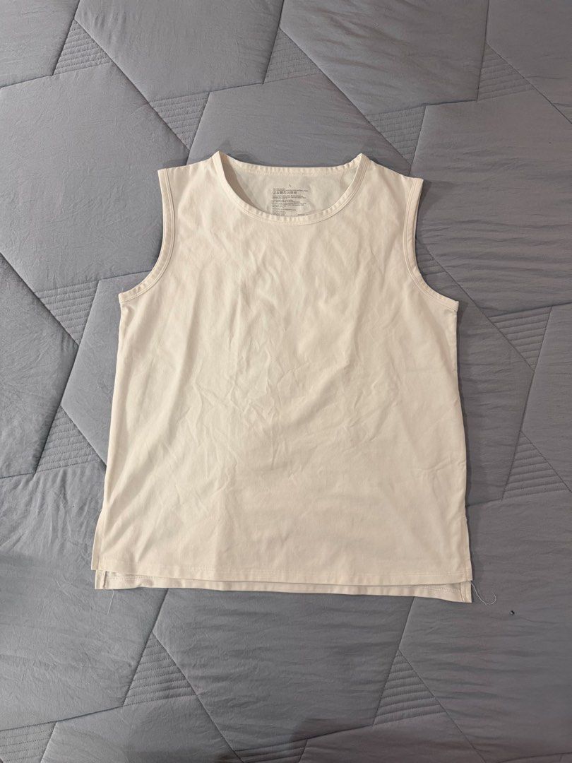 MUJI active white tank top muscle tee (Category: Sleeveless) located in Pasig City. Submitted by tnyap (Listing ID 1443784536, Image 1). Description: Size L L - 23.5in W - 19in Dry fit texture.