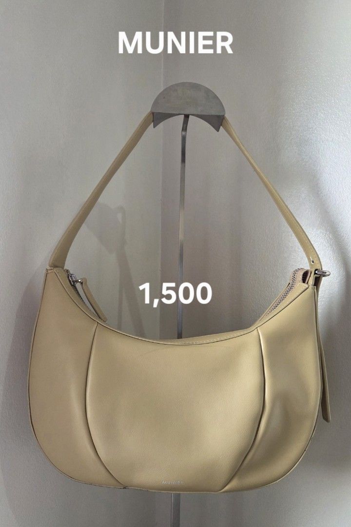 MUNIER Beige Shoulder Bag (Category: Shoulder Bags) located in San Juan City. Submitted by mjdeclutters (Listing ID 1443799758, Image 1). Description: MUNIER shoulder bag Light beige color Small issue on piping (refer to close-up photo) .