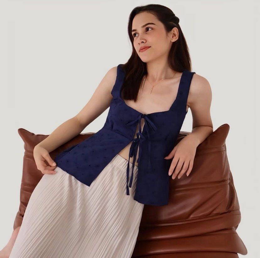 Navy Blue Eyelet Ribbon Tie Top (Category: Sleeveless) located in Pasay City. Submitted by lovedby.mmm (Listing ID 1443830688, Image 3). Description: ۶ৎ with adjustable front ribbon ties (can tie tight or loose shown in slides 2-3), fits xs-s ۶ৎ love this top sm, can style in so many diff ways ۶ৎ super cute, perfect for cafe/mall dates, ootd, school · · ─ ·ʚɞ· ─ · · ۶ৎ mop: gcash ۶ৎ mod: same day delivery (lalamove/grab) tags: brandy melville isa