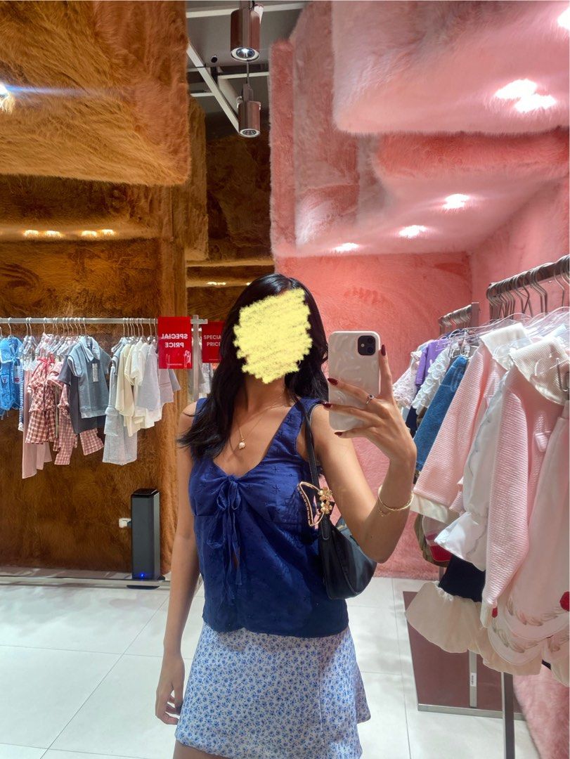 Navy Blue Eyelet Ribbon Tie Top (Category: Sleeveless) located in Pasay City. Submitted by lovedby.mmm (Listing ID 1443830688, Image 2). Description: ۶ৎ with adjustable front ribbon ties (can tie tight or loose shown in slides 2-3), fits xs-s ۶ৎ love this top sm, can style in so many diff ways ۶ৎ super cute, perfect for cafe/mall dates, ootd, school · · ─ ·ʚɞ· ─ · · ۶ৎ mop: gcash ۶ৎ mod: same day delivery (lalamove/grab) tags: brandy melville isa
