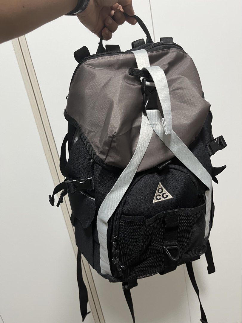 Nike ACG Backpack (Category: Backpacks) located in Kuala Lumpur. Submitted by stickyfingersss (Listing ID 1443085708, Image 1). Description: - Black and grey Nike ACG backpack - Top flap closure with buckle - Multiple pockets and straps for carrying - Reflective strips on the back - Ideal for everyday use or short trips (3-4days) Condition like new Price slightly nego..