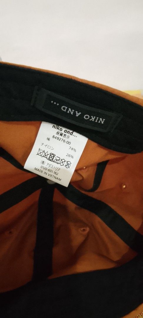 Niko and... Cap Orange Black (Category: Caps & Hats) located in Bago City. Submitted by champsthrift. (Listing ID 1443909046, Image 2). Description: - Brand: Niko and... - Color: Orange and Black - Origin: Made in Vietnam - Material: Likely Nylon and Polyester blend - Style: Simple, suitable for everyday wear.