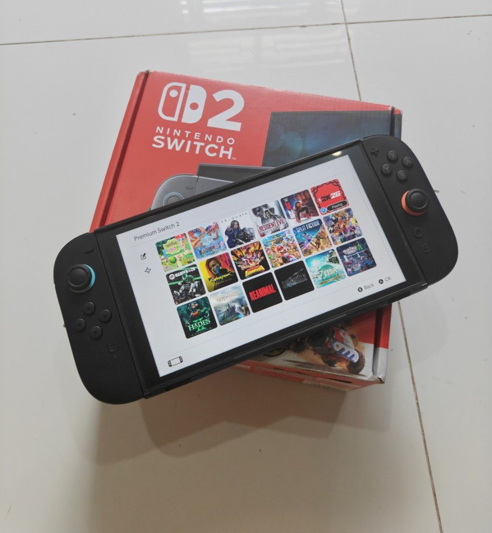 Nintendo Switch 2 with games (Category: Nintendo) located in Manila. Submitted by nswitchgear (Listing ID 1443764568, Image 2). Description: Nintendo Switch 2 with Free games ₱27,989 firm Can be trade sa Lower unit add cash FREE acess to my Paid games Legit purchase not Jailbreak. Preloved in good condition May minor sign of usage 2 Yrs warranty with soft copy receipt Complete accessories (Box,charger,grips,straps,hdmi) Any of my Digital PAID Sha