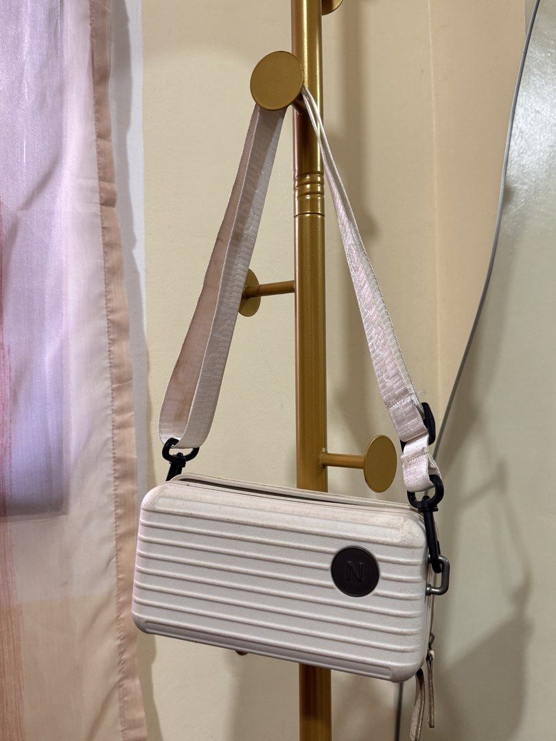 Nuprene Lucca Bag in Off-White (Category: Sling Bags) located in Pasig City. Submitted by cattleyass (Listing ID 1443753476, Image 1). Description: No issues. Need cleaning‼️ Comes with leather strap Auto Pass sa low ball Last price posted.