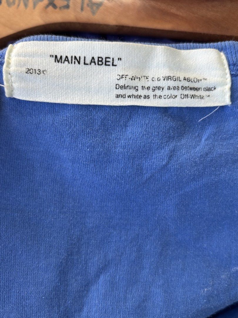 Off-White "Main Label" Blue Graphic T-Shirt (Category: Tshirts & Polo Shirts ) located in Manila. Submitted by alexander_finds (Listing ID 1443813007, Image 3). Description: - Authentic Off-White 'Main Label' blue t-shirt - Features eye-catching graphic print on both front and back - Made in UE (European Union) - Care instructions available on the tag.