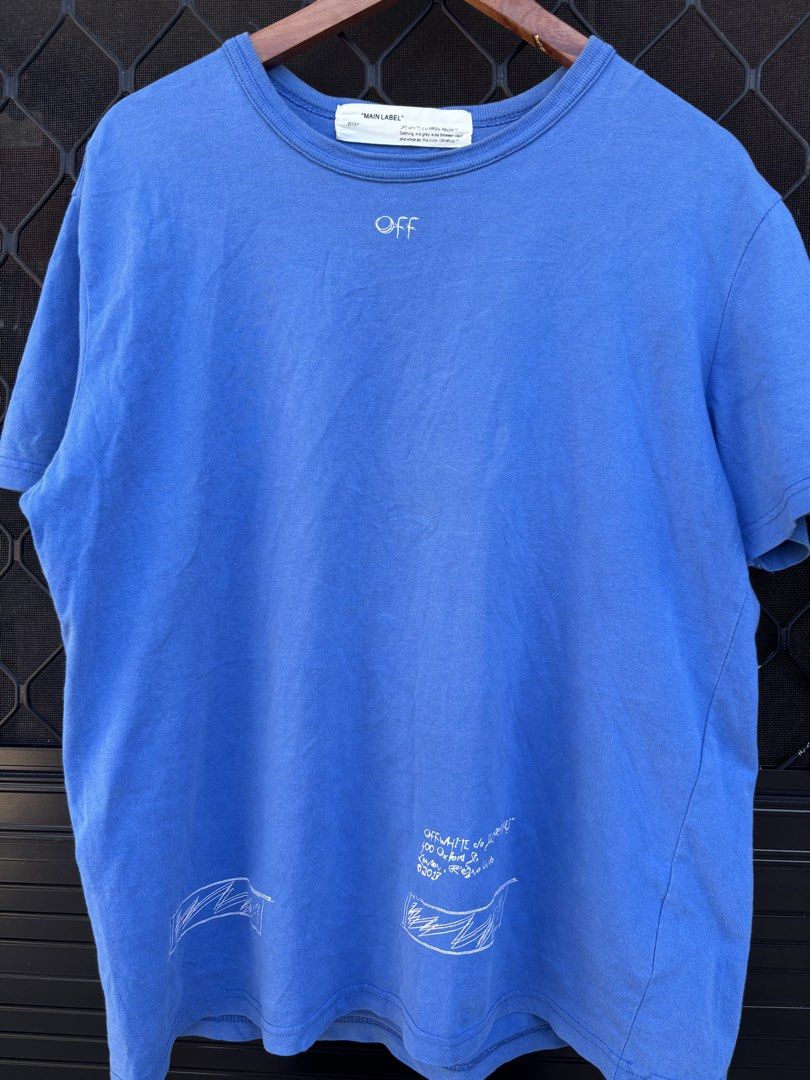 Off-White "Main Label" Blue Graphic T-Shirt (Category: Tshirts & Polo Shirts ) located in Manila. Submitted by alexander_finds (Listing ID 1443813007, Image 1). Description: - Authentic Off-White 'Main Label' blue t-shirt - Features eye-catching graphic print on both front and back - Made in UE (European Union) - Care instructions available on the tag.