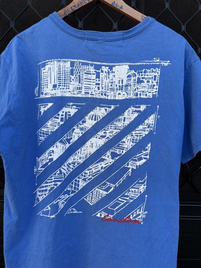 Off-White "Main Label" Blue Graphic T-Shirt (Category: Tshirts & Polo Shirts ) located in Manila. Submitted by alexander_finds (Listing ID 1443813007, Image 2). Description: - Authentic Off-White 'Main Label' blue t-shirt - Features eye-catching graphic print on both front and back - Made in UE (European Union) - Care instructions available on the tag.