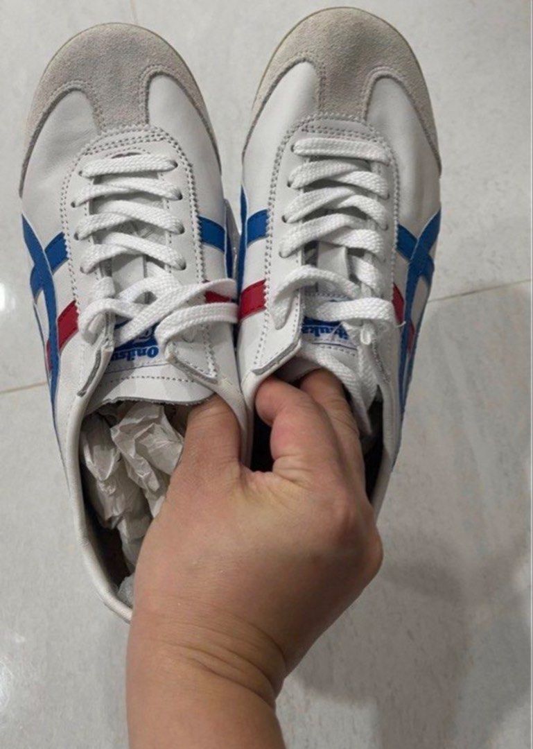 Onitsuka Tiger Mexico 66 White Blue Red Sneakers (Category: Sneakers) located in Singapore. Submitted by swisszip97 (Listing ID 1443750846, Image 1). Description: - Classic Onitsuka Tiger Mexico 66 - Color: White with blue and red stripes - Material: Suede and leather upper - Laces: White - Perfect for casual wear - Popular and sought-after model - Ready for its next owner.