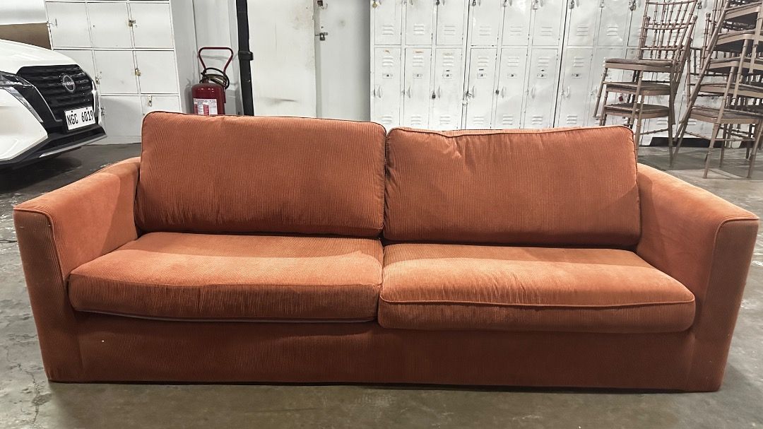 Orange Corduroy 4 Seater Sofa (Category: Sofas) located in Makati City. Submitted by ngmark448729340 (Listing ID 1443791015, Image 1). Description: - Orange corduroy sofa - Includes 2 seat cushions and 2 back cushions - Comfortable and stylish design - Versatile size, fits well in most living spaces - Ideal for lounging and relaxing - Selling because of redecoration - Pick up only.
